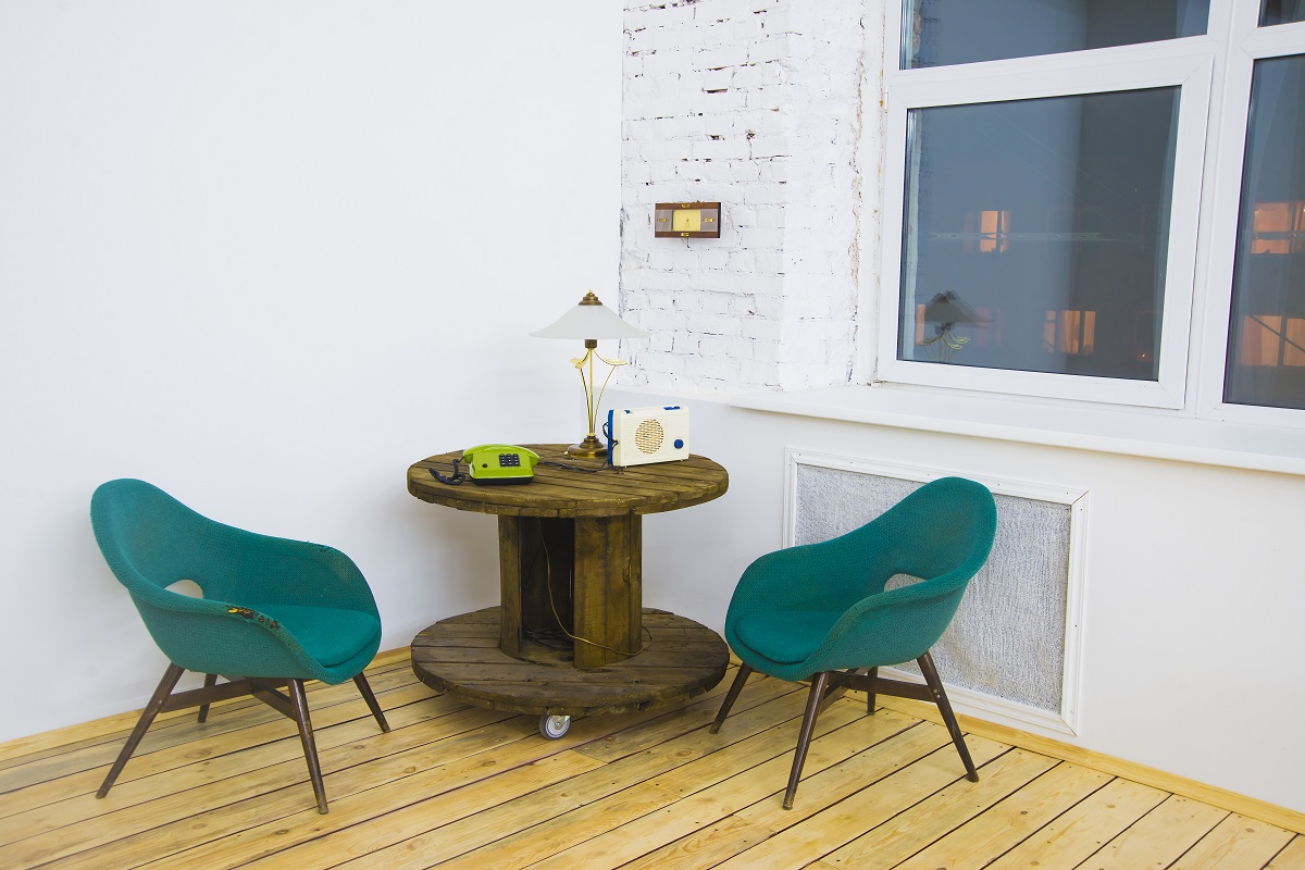 Two green chairs in house corner