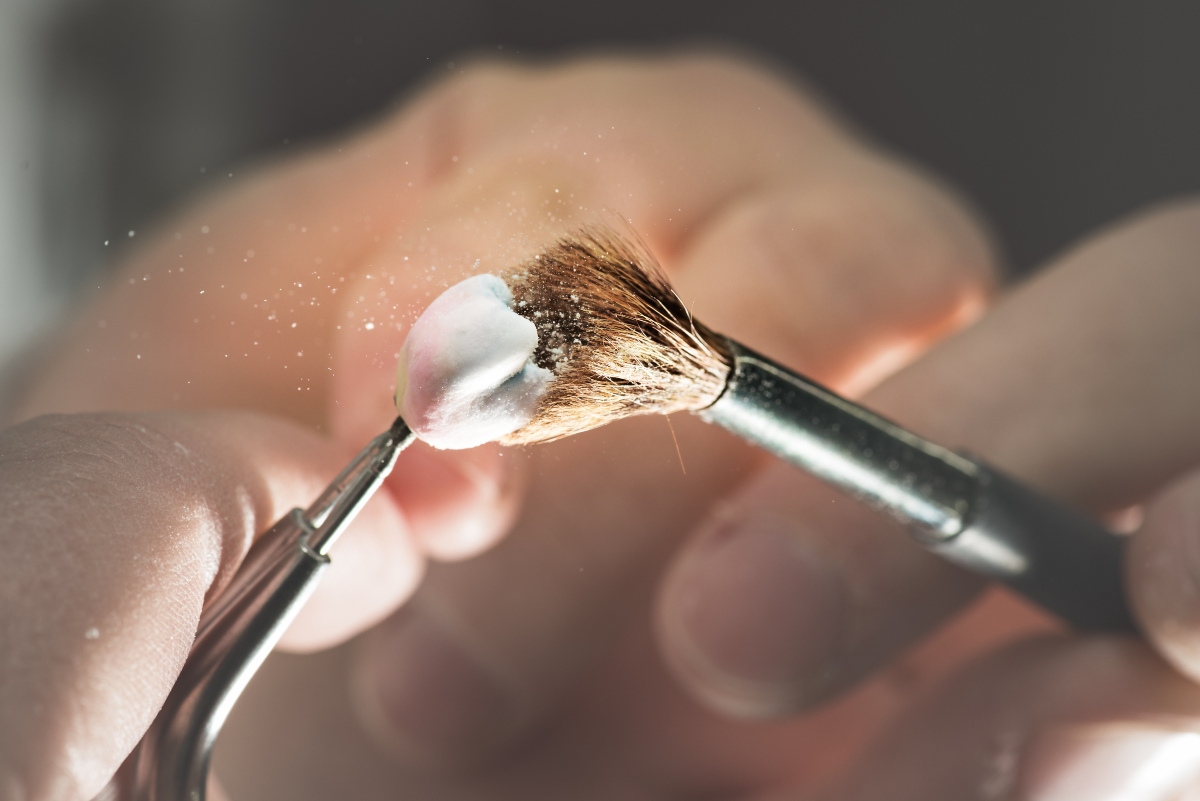 dentist brushing a dental implant