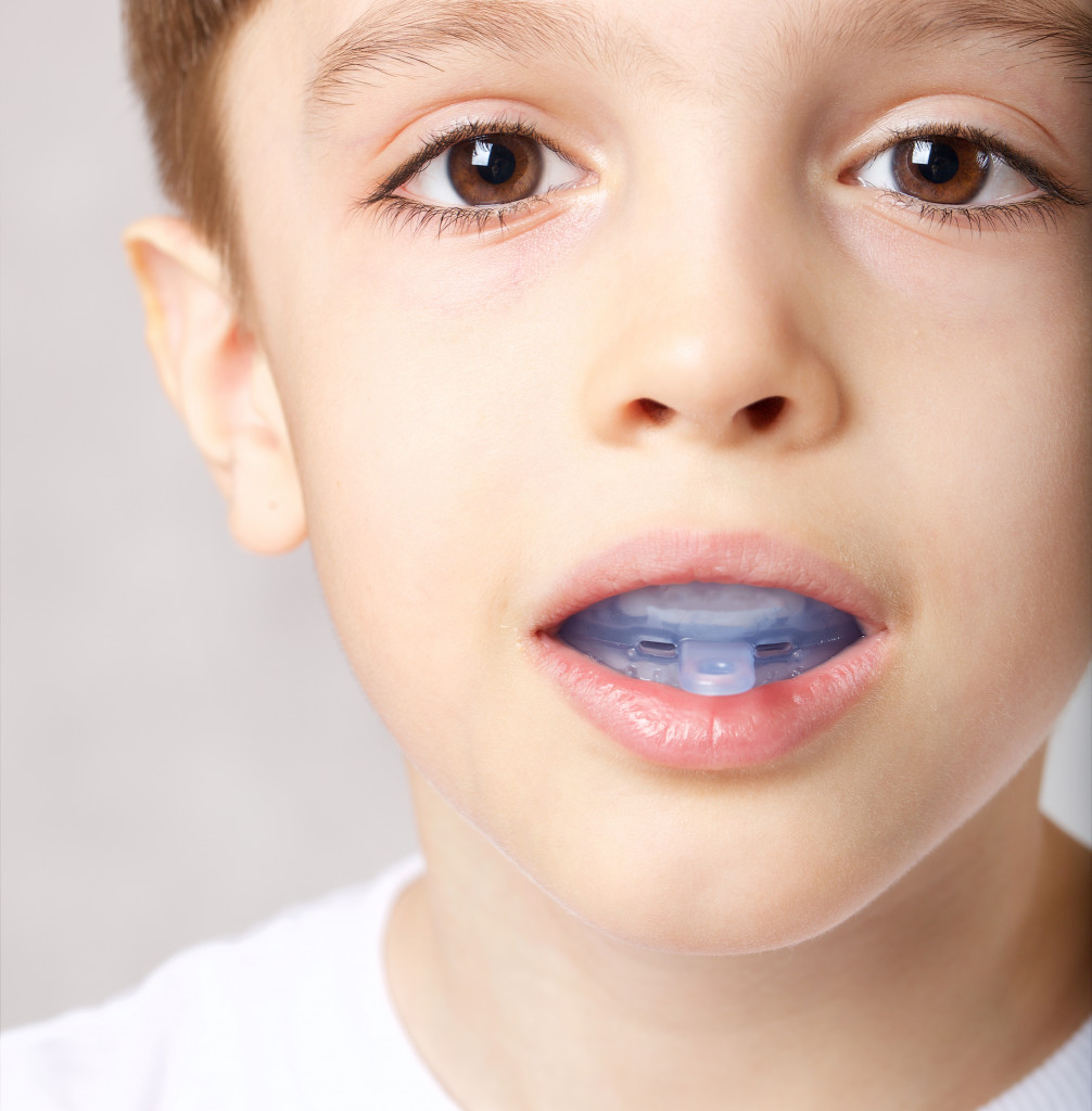 A kid stopping snoring with mouth guard