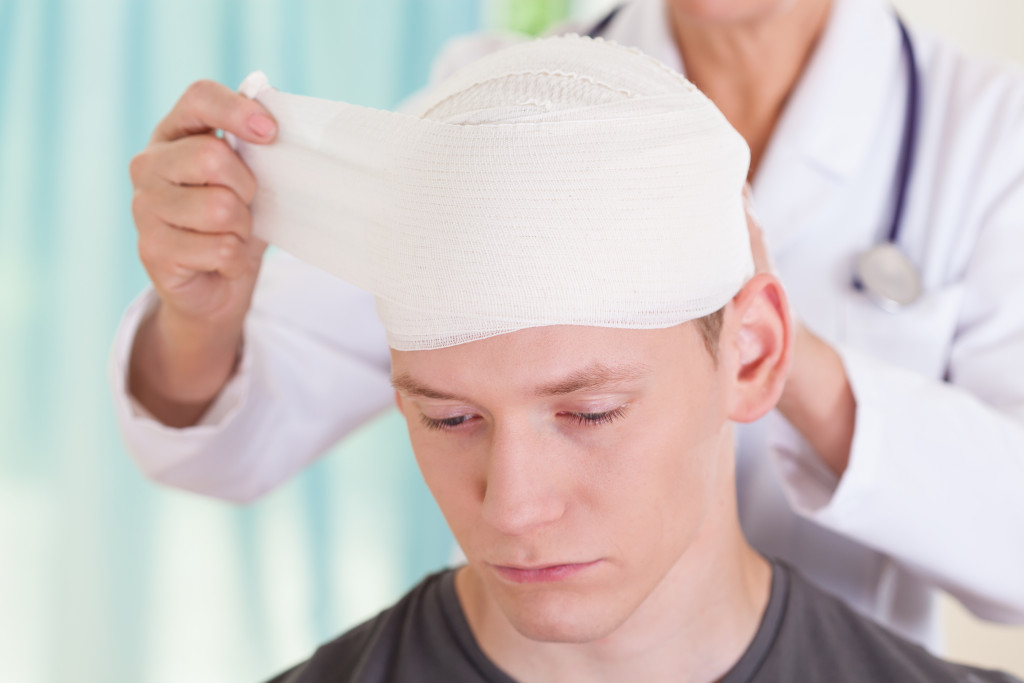 a person with a head bandage
