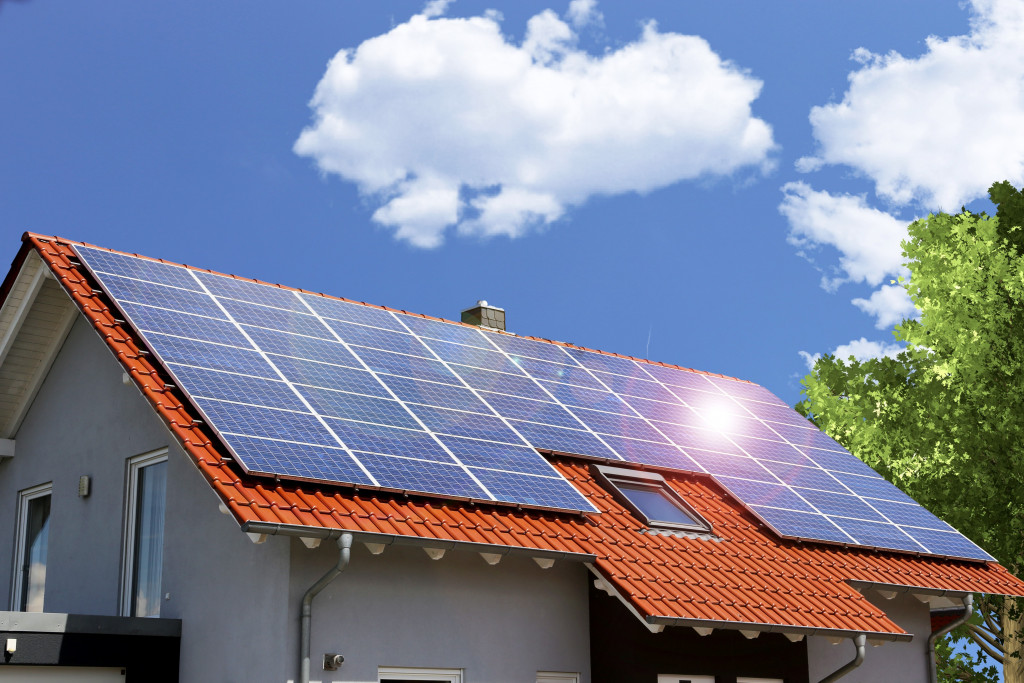 solar panels on a house's roof with sky as background