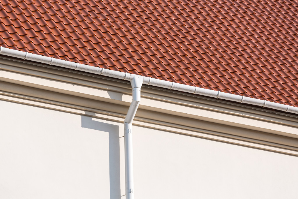 Rain gutter and downspout on the roof and wall