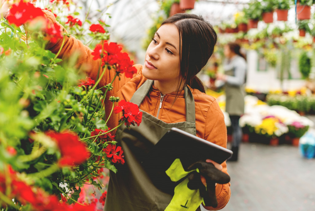 A woman caring for flowers