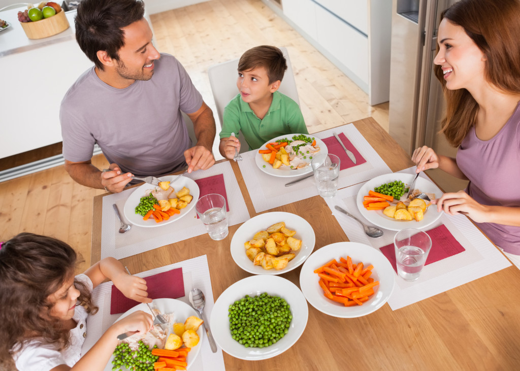 Family eating a healthy meal at home. 