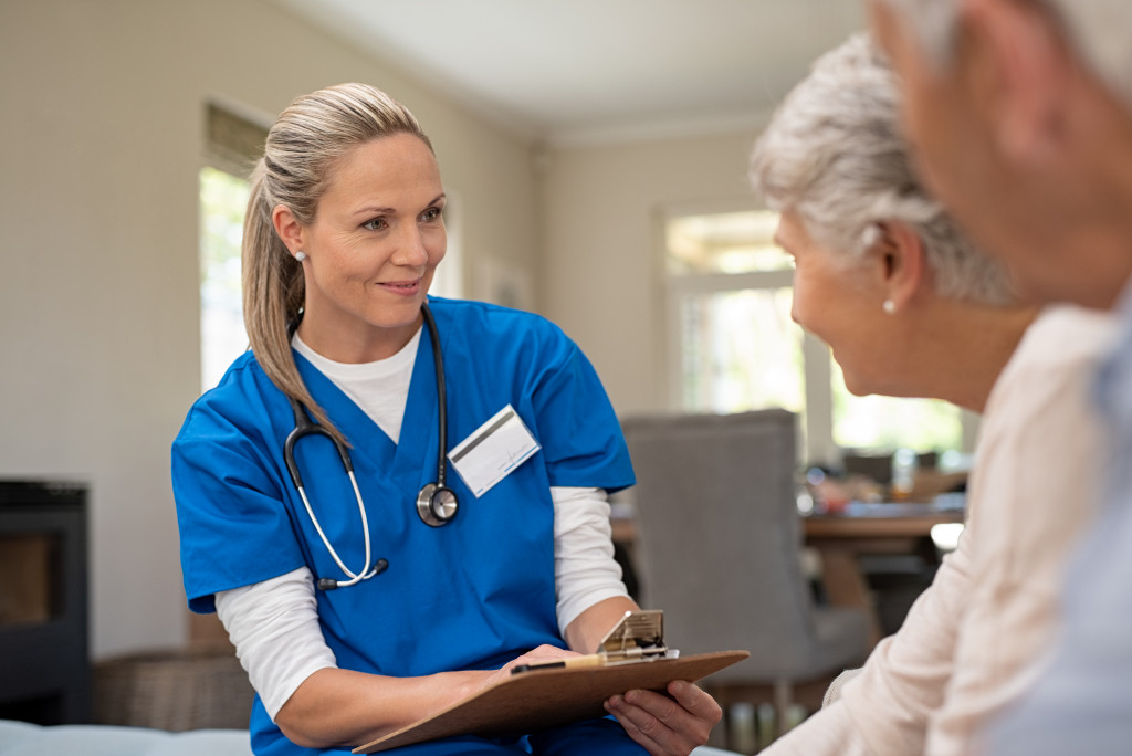 Doctor checking the health of a senior couple.