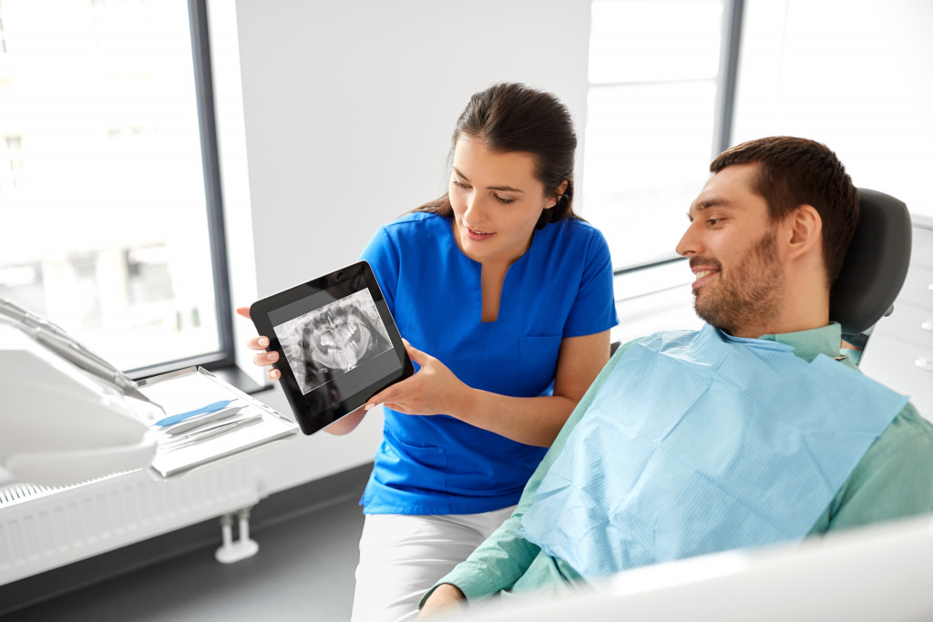 a male patient with his dentist