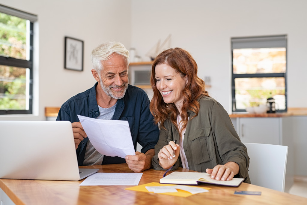 mature adult couple checking their home finances