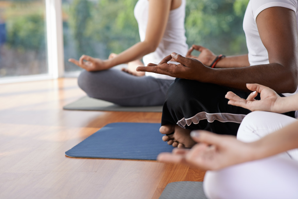 People sitting in a lotus position.