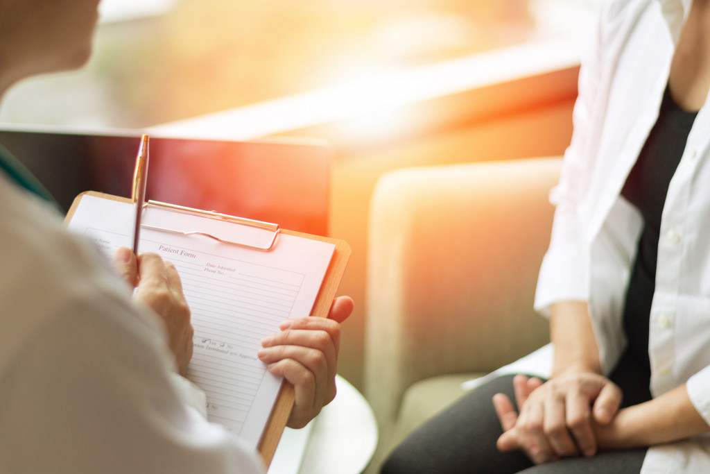 therapist speaking with patient